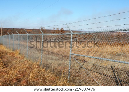 Field with a large wire fence