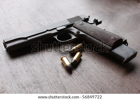 Gun and bullets on a table