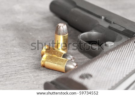 Gun with bullets. Gun is desaturated for stronger effect on bullets