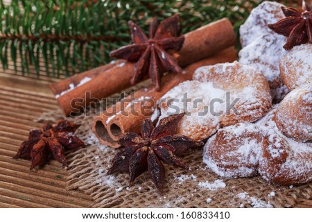 Cookies with cinnamon and anise on a wooden background