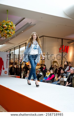 BADEN-BADEN, GERMANY - MARCH 7: Fashion model wearing clothes from the spring collection in a shopping center   on March 7, 2015 in Baden-Baden. Germany. Europe.