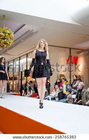 BADEN-BADEN, GERMANY - MARCH 7: Fashion model wearing clothes from the spring collection in a shopping center on March 7, 2015 in Baden-Baden. Germany. Europe.
