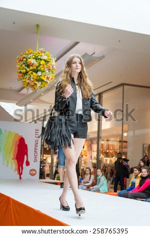 BADEN-BADEN, GERMANY - MARCH 7: Fashion model wearing clothes from the spring collection in a shopping center on March 7, 2015 in Baden-Baden. Germany. Europe.