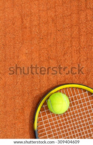 Sport background with a tennis racket and ball. Vertical image.