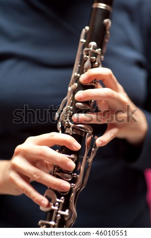 woman playing a clarinet