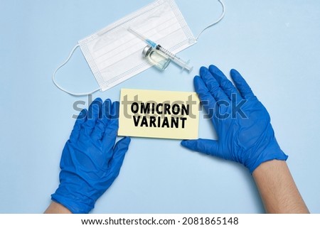 Doctor hand holds a card with text - New covid variant Omicron. Covid-19 new variant - Omicron. Omicron variant of coronavirus. SARS-CoV-2 variant of concern
