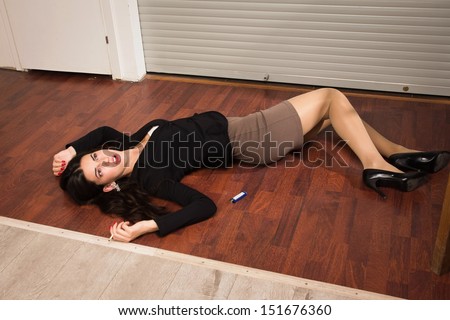 Crime scene in a office with lifeless businesswoman lying on the floor