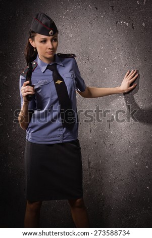 Woman police officer with gun