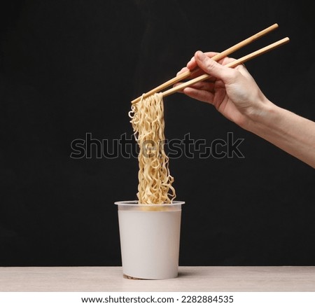 Similar – Image, Stock Photo Green pasta in plastic packing on dark kitchen table with kale and other ingredients. Top view