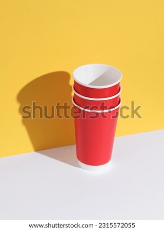 Similar – Image, Stock Photo Paper cup with red drink in the holder of a construction fence