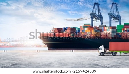 Container cargo freight ship during discharging at industrial port move to container yard by trucks, handlers, cargo plane, copy space, logistic import export background and transport industry concept Zdjęcia stock © 
