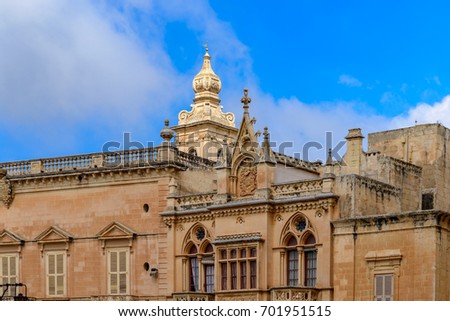 Architectural mix of styles: House facade at St. Pauls's Square in Mdina, Malta - The background shows the tower of the Carmelite Church Stock fotó © 