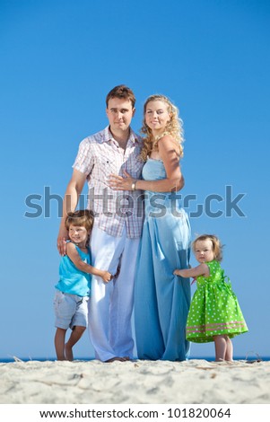 young family rests  at sea