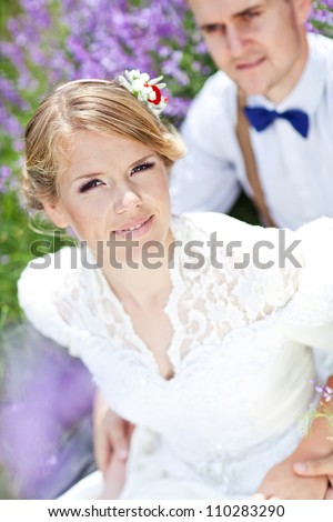 The bride and groom in the spring nature close-up portrait