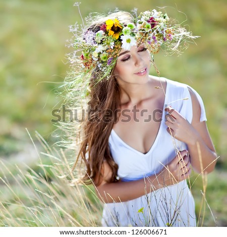 Beautiful woman with flower wreath.