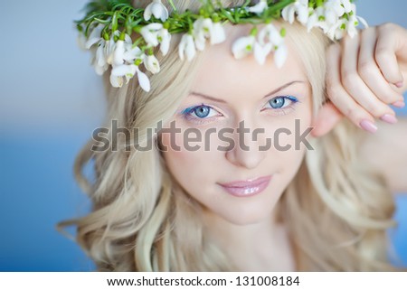 spring portrait girl with wreath of flowers , pastel shades