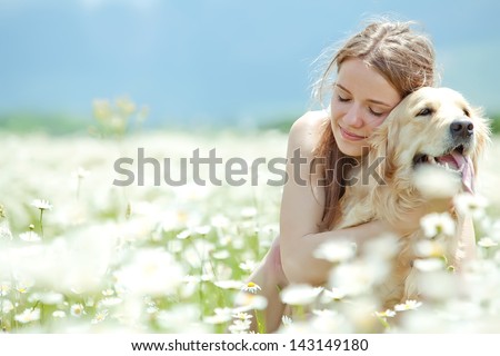 Beautiful woman playing with her ??dog. Outdoor portrait. series