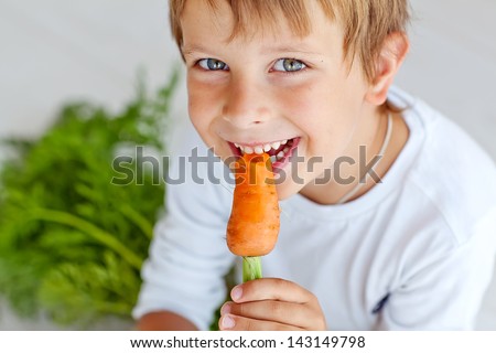 Similar – Image, Stock Photo Child eating fresh carrot