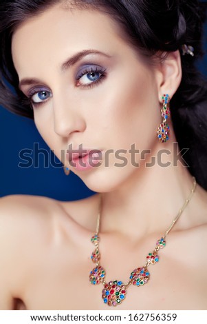 Portrait of a woman with evening make-up. Jewelry and Beauty. Fashion art photo