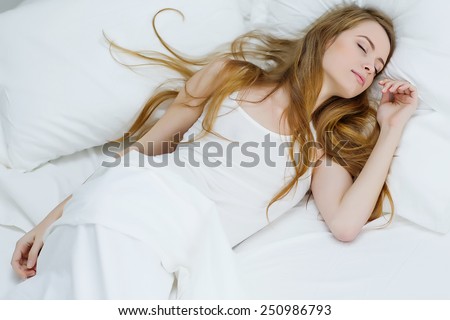 lonely woman in bed  overhead view of sleeping beauty