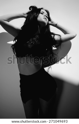 Black and white art photo. Sexy woman in black and white photo.