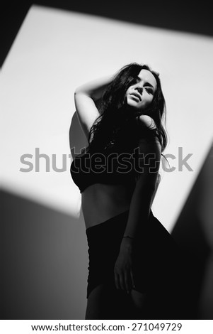 Black and white art photo. Sexy woman in black and white photo.