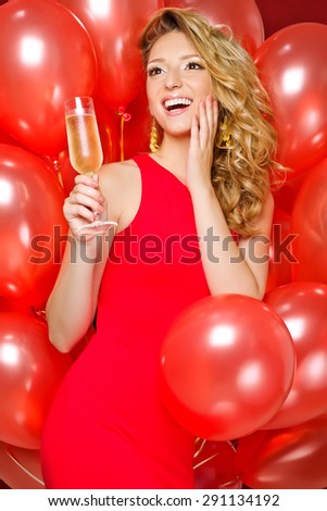 A beautiful woman at a party with champagne