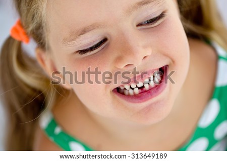 The child dropped the first milk tooth