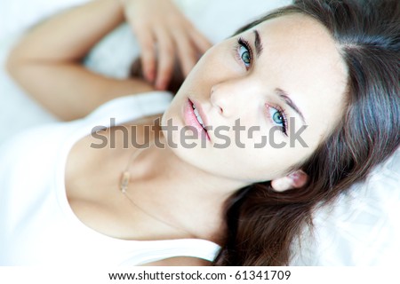 A beautiful girl resting on the bed