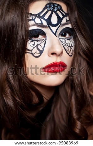 Young woman with creative makeup