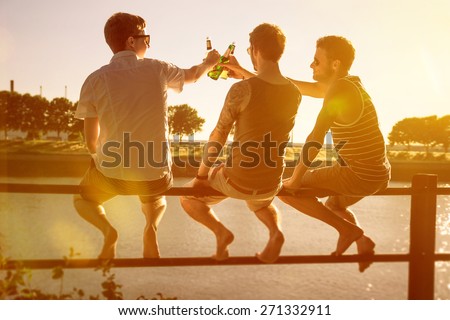 Three friends drinking beer