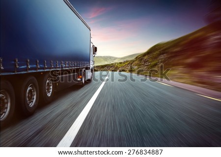 A truck driver going down a road
