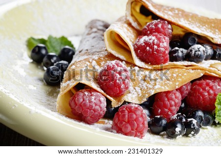 Delicious Tasty Homemade crepes with raspberries
