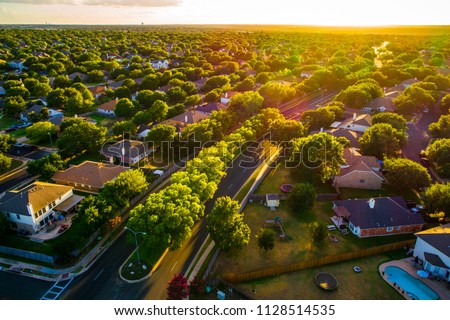Sunny days ahead, Sunset real estate suburb homes. Community suburbia neighborhood in north Austin in suburb Round Rock , Texas Aerial drone view above new development Stock foto © 