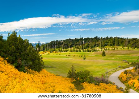 Beautiful landscape of Llao Llao Hotel golf field with flowered hill in Villa la Angostura Patagonia Argentina