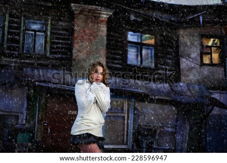 girl on a background of the night winter home
