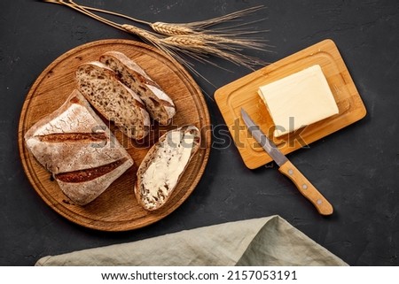 Similar – Image, Stock Photo Home-baked bread top view. Sourdough bread buns.