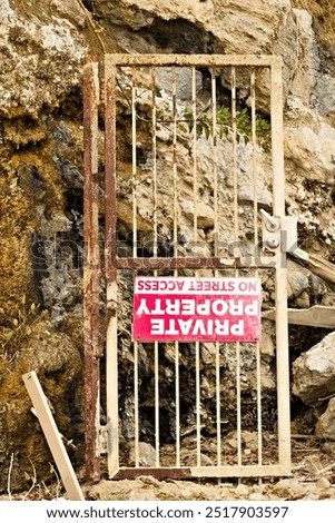 Similar – Foto Bild kaputtes Privatgrundstück Betreten verboten Schild am Tor zwischen zwei Häusern