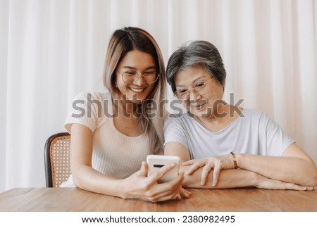 Similar – Image, Stock Photo Mother and Daughter watching sunset