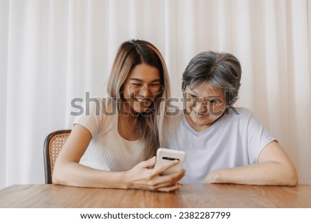 Similar – Image, Stock Photo Mother and Daughter watching sunset