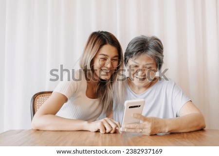 Similar – Image, Stock Photo Mother and Daughter watching sunset