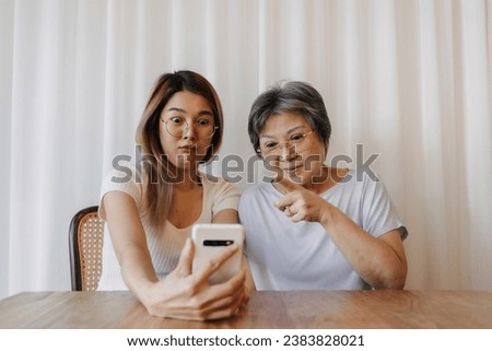 Similar – Image, Stock Photo Mother and Daughter watching sunset