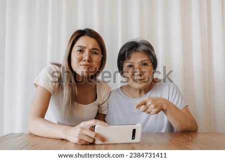 Similar – Image, Stock Photo Mother and Daughter watching sunset