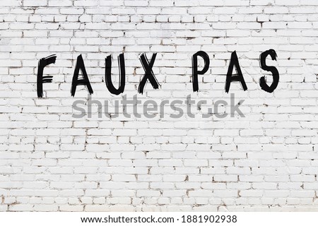 Inscription faux pas written with black paint on white brick wall. ストックフォト © 