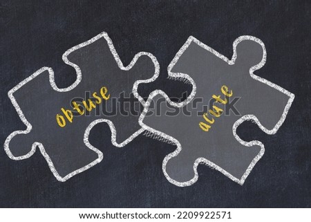Chalk drawing of two puzzles with words obtuse and acute. Concept of solving problems Stock fotó © 