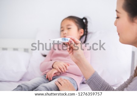 Similar – Image, Stock Photo Mother checking on her children who is riding in the front section of a cargo bike