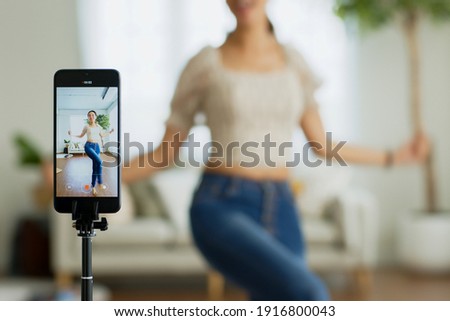 Similar – Foto Bild junge Frau streamt Musik vom Smartphone über Kopfhörer