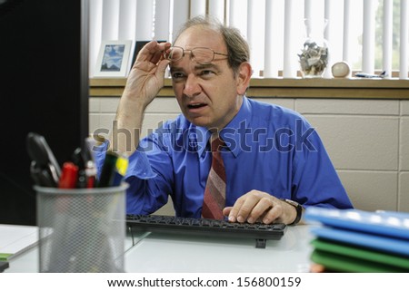 Businessman reading his email on computer, horizontal