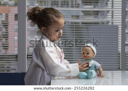 female child playing doctor