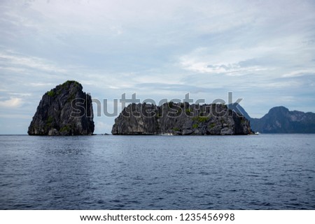 Similar – Image, Stock Photo Rocky formations near still lake